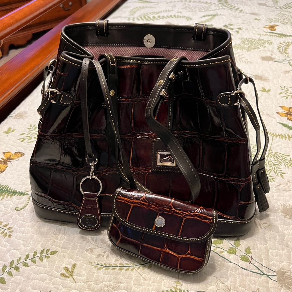 Amazingly beautiful Genuine Dooney and Bourke  Leather Embossed Satchel.